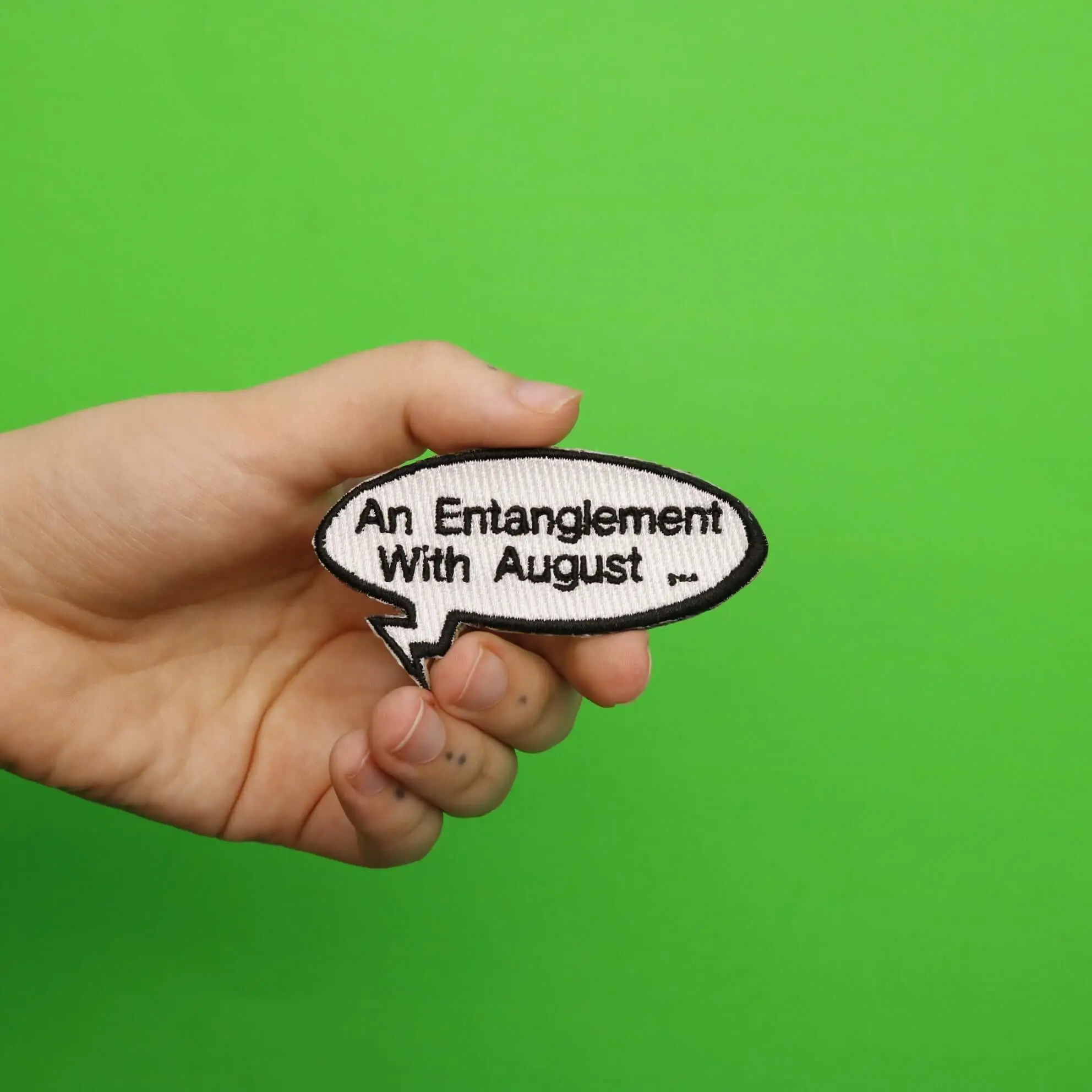 "An Entanglement With August..." Word Bubble Embroidered Iron On Patch - Image 2
