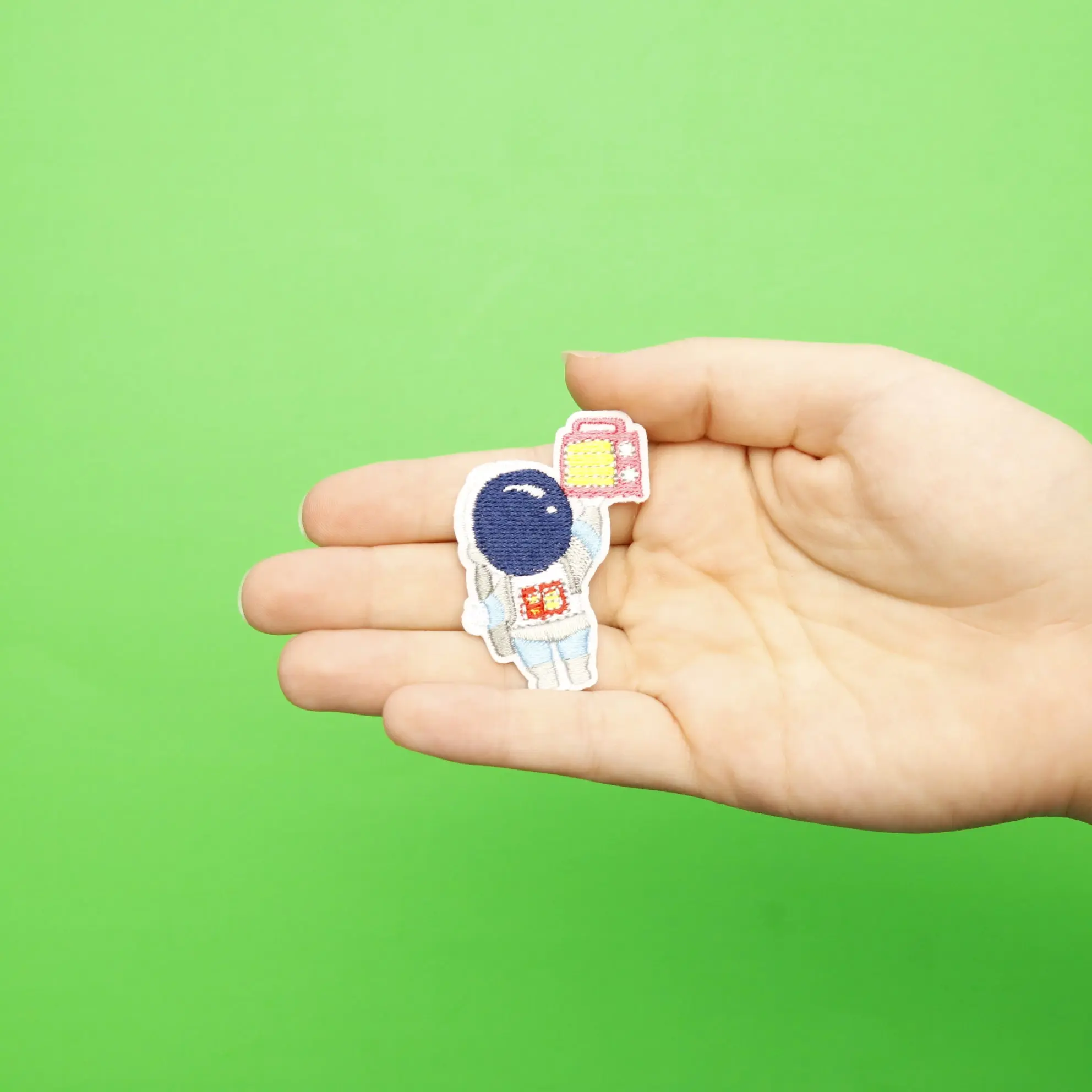 Small Blue Astronaut Holding A Radio Embroidered Iron On Patch - Image 2